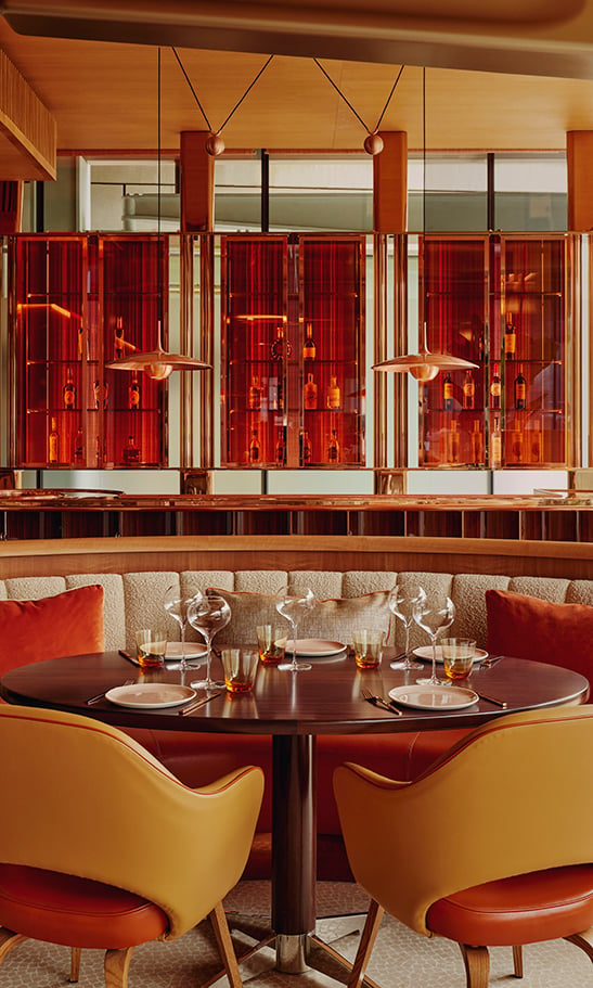 Restaurant interior of abc kitchens. Tables and chairs are dotted around the room