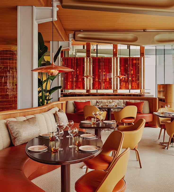 Restaurant interior of abc kitchens. Tables and chairs are dotted around the room