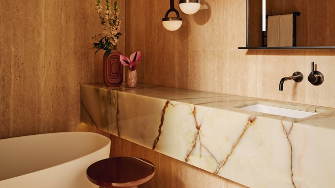 Marble counter top in bathroom with edge of bathtub showing